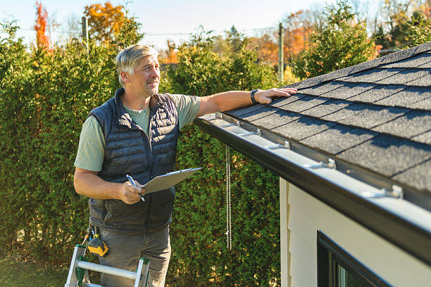 Professional Hail Damage Roof Repair technician working in Knoxville, IL